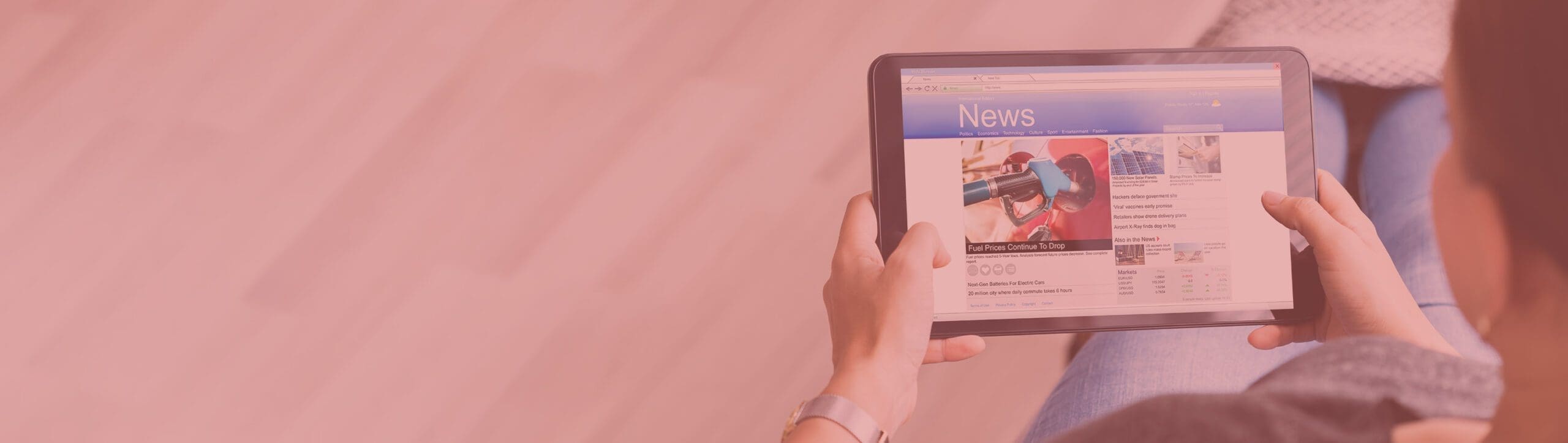 a woman reading the news on a tablet